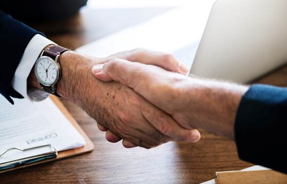 two men shaking hands